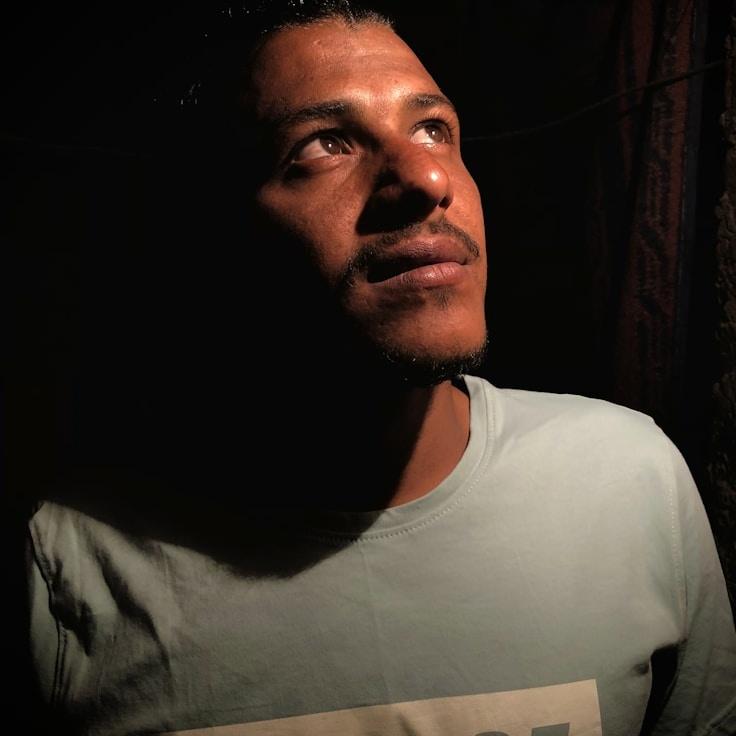 Alex Chen, Lead Design Curator at MossyCloudSea, reviewing corporate floral arrangements